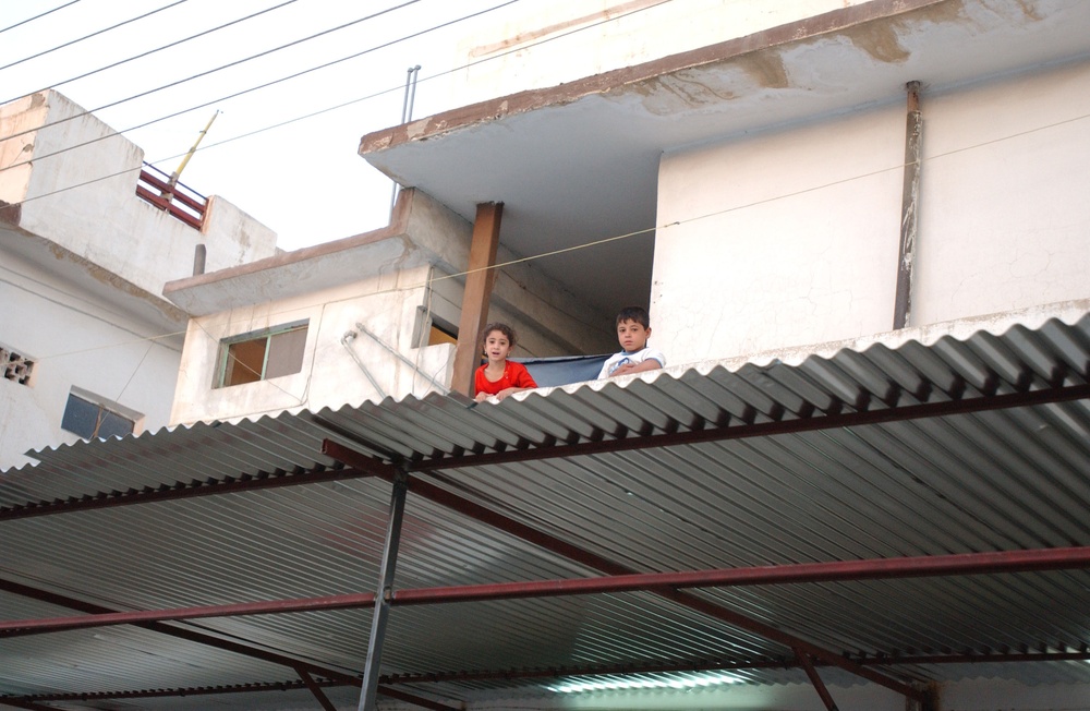 Soldiers Walk Through Al-Karama Neighborhood