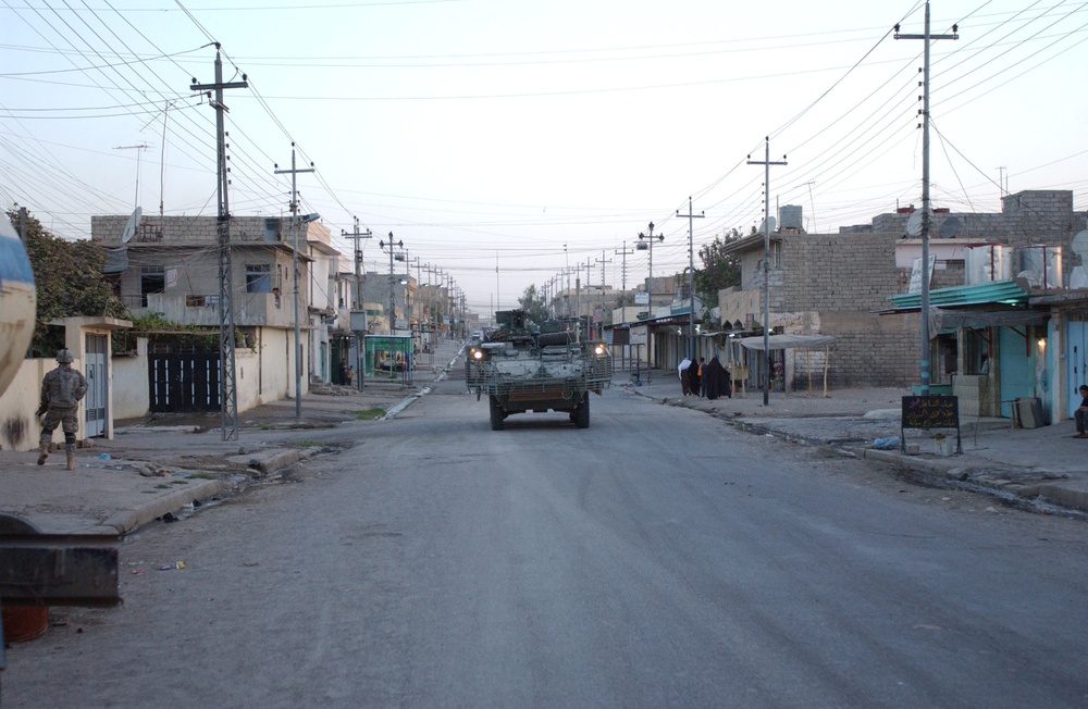 Soldiers Walk Through Al-Karama Neighborhood