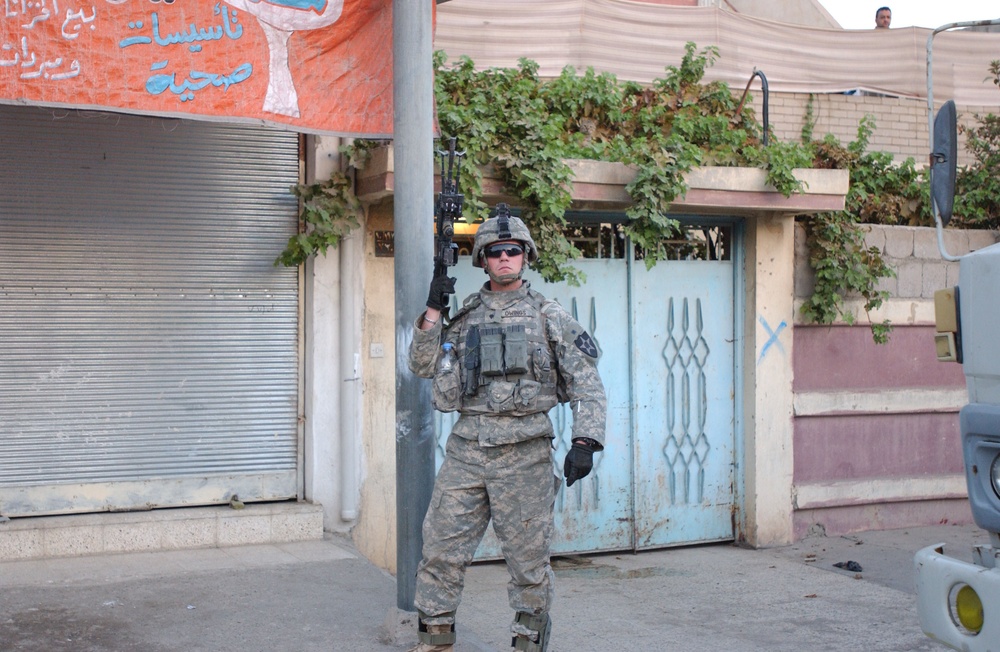 Soldiers Walk Through Al-Karama Neighborhood