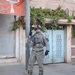 Soldiers Walk Through Al-Karama Neighborhood