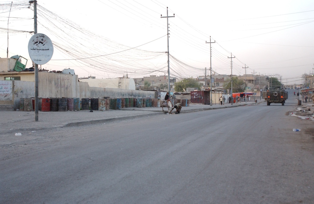 Soldiers Walk Through Al-Karama Neighborhood