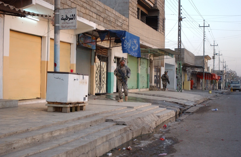 Soldiers Walk Through Al-Karama Neighborhood