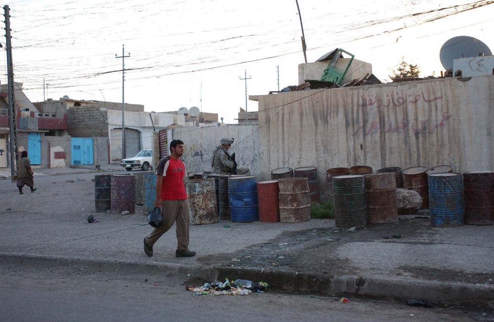 Soldiers Walk Through Al-Karama Neighborhood