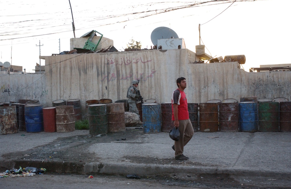 Soldiers Walk Through Al-Karama Neighborhood