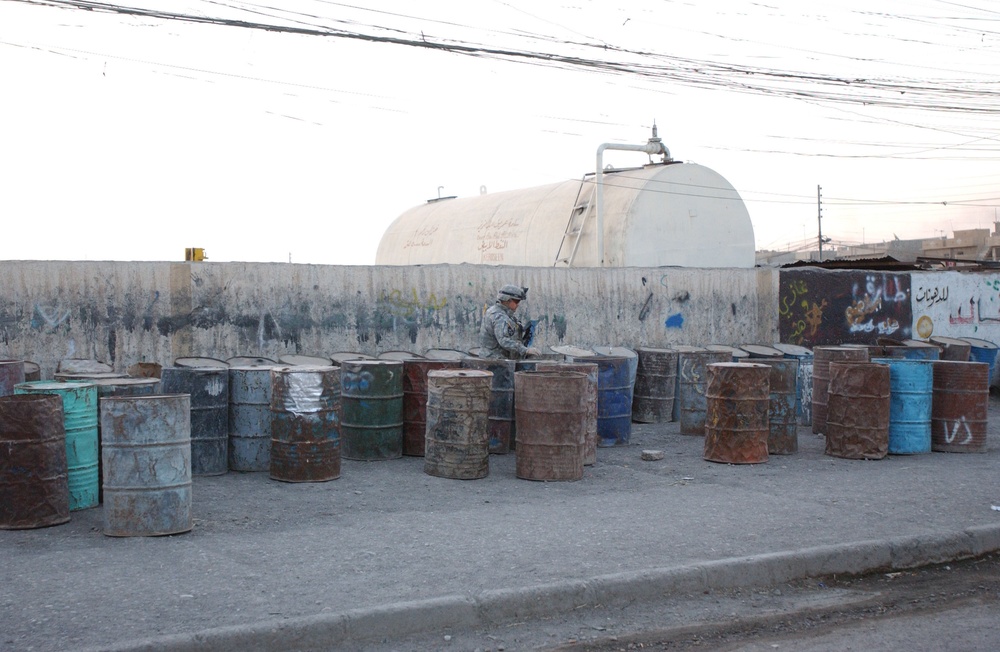 Soldiers Walk Through Al-Karama Neighborhood