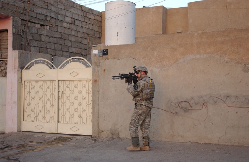 Soldiers Walk Through Al-Karama Neighborhood