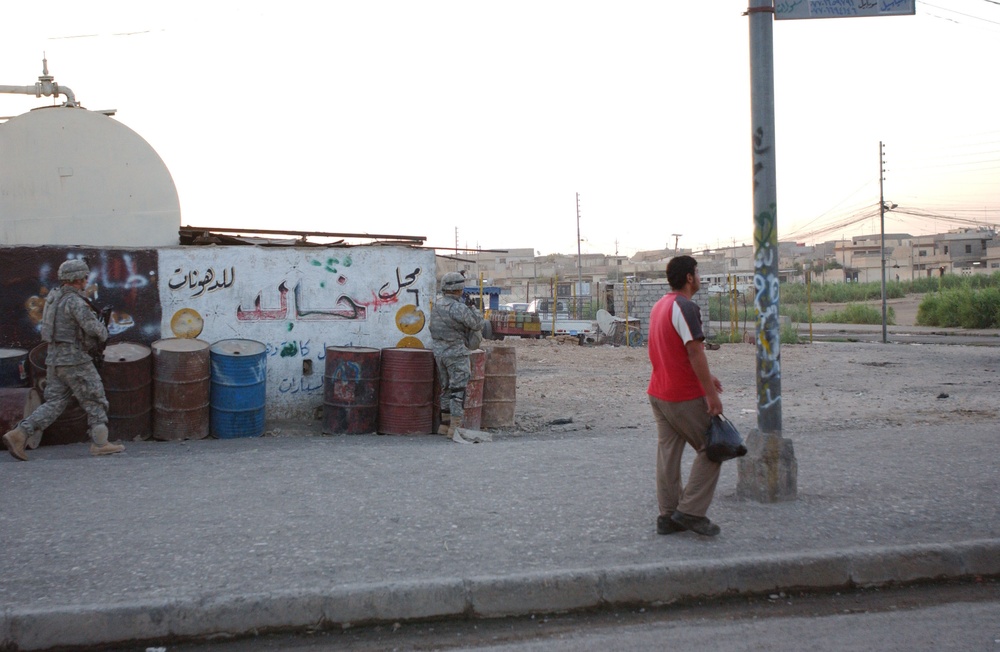 Soldiers Walk Through Al-Karama Neighborhood