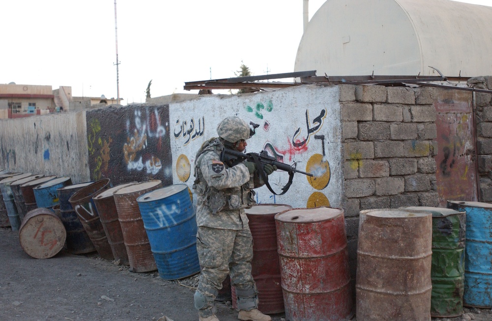 Soldiers Walk Through Al-Karama Neighborhood