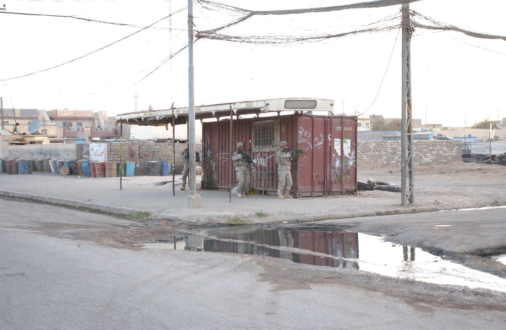 Soldiers Walk Through Al-Karama Neighborhood