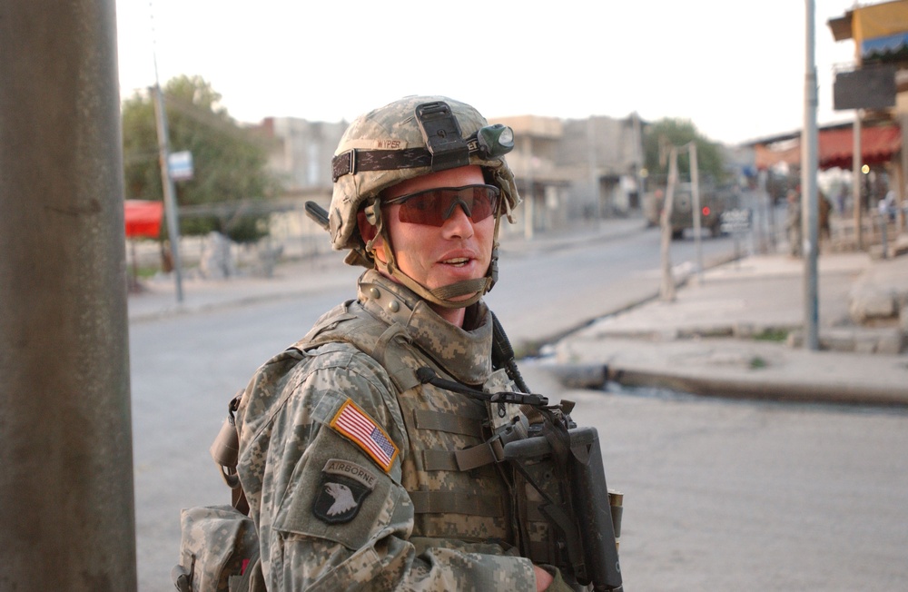 Soldiers Walk Through Al-Karama Neighborhood