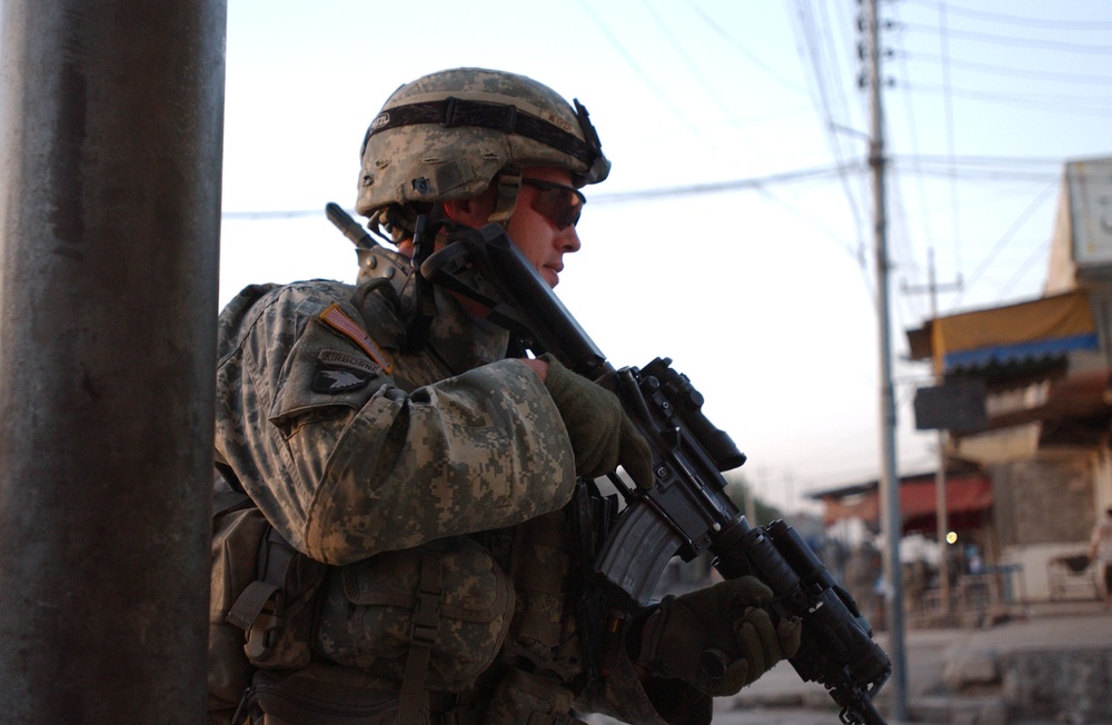 Soldiers Walk Through Al-Karama Neighborhood