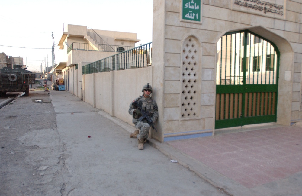 Soldiers Walk Through Al-Karama Neighborhood