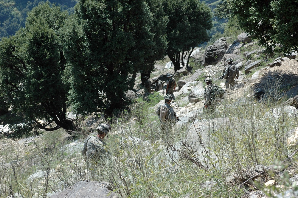 Soldiers Negotiate Mountainous Terrain on Patrol