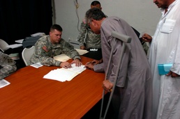 Soldiers give compensation to landowners near Balad