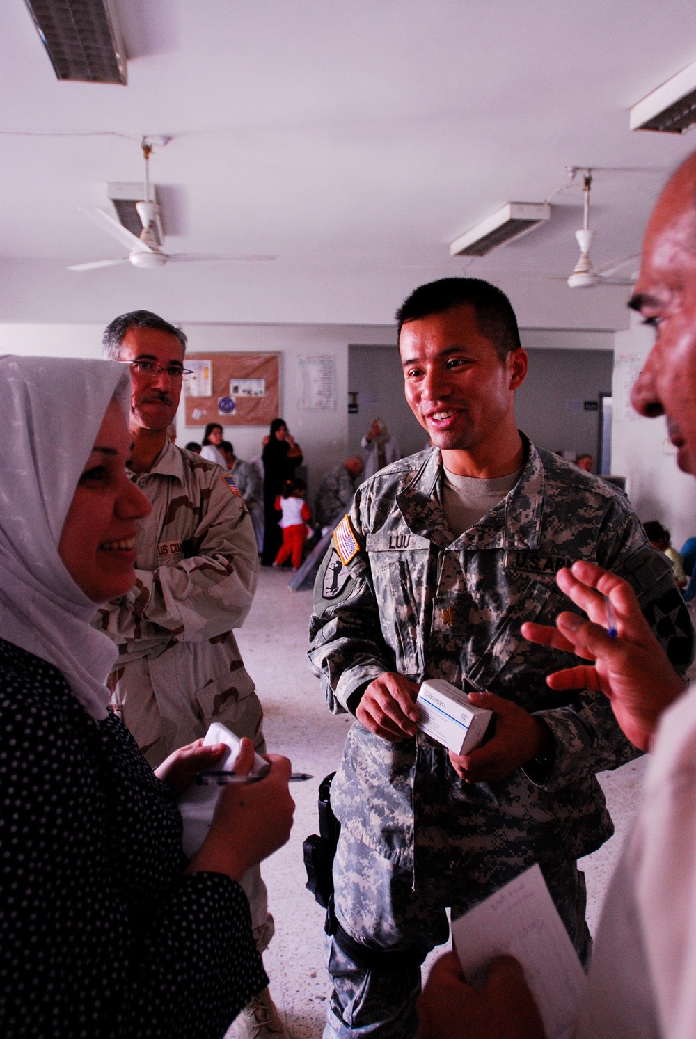 MND-B Soldiers work with the Ministry of Health to care for residents of Gh