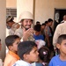 Soldiers deliver supplies to schoolchildren