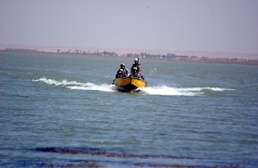 Hunters Survey Lake, Hope to Halt Insurgent Flow of Goods