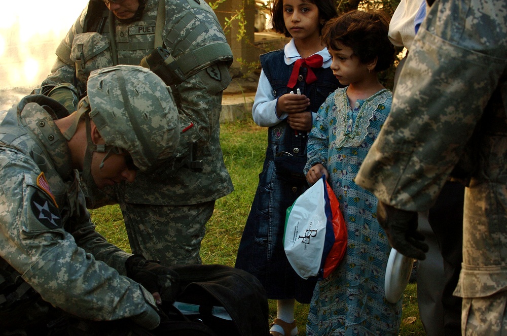 Stryker Soldiers work with Iraqi Police and security forces