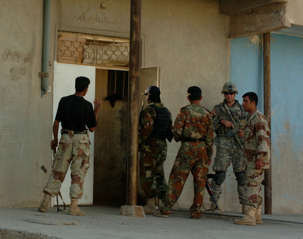 Stryker Soldiers work with Iraqi Police and security forces