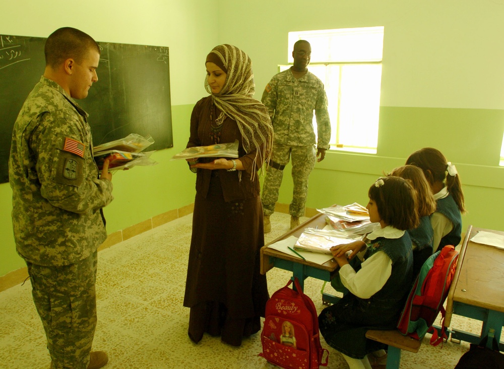 Civil Affairs Soldiers Help Students, Visit Displaced Kurds From 'Anfal' Ca