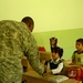 Civil Affairs Soldiers Help Students, Visit Displaced Kurds From 'Anfal' Ca