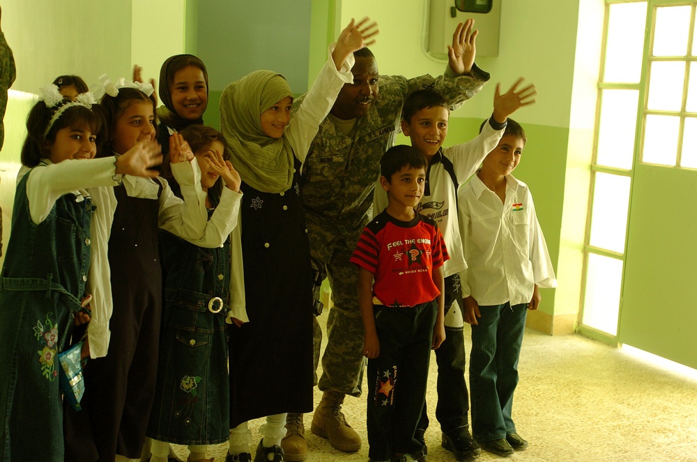 Civil Affairs Soldiers Help Students, Visit Displaced Kurds From 'Anfal' Ca