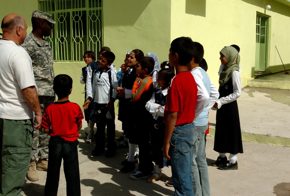 Civil Affairs Soldiers Help Students, Visit Displaced Kurds From 'Anfal' Ca