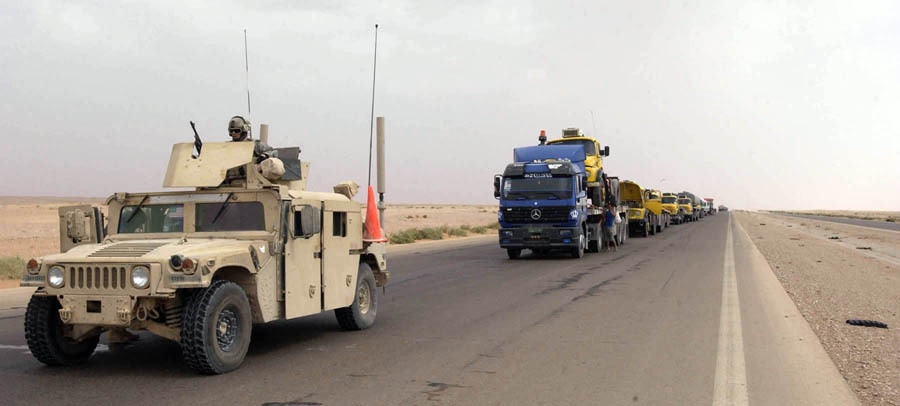 Traveling Soldiers watch over convoys