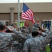 CAMP ARIFJAN, Kuwait (November 11, 2006) --Soldiers from Area Support Group - Kuwait salute as the flag is lowered during a retreat ceremony remembering Veterans Day on camp Nov. 11.