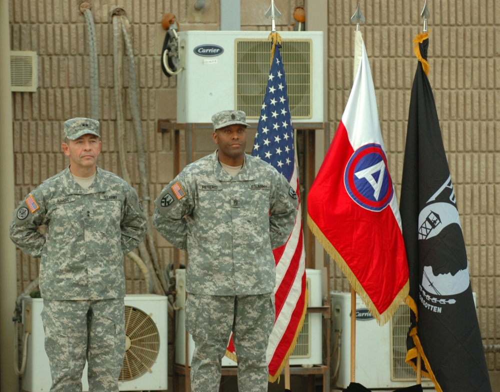 CAMP ARIFJAN, Kuwait (November 11, 2006) -- Maj. Gen. Dennis Hardy, the Third Army/ U.S. Army Central deputy commanding general, and Command Sgt. Maj. Rossie Peters, command sergeant major for the 377th Theater Support Command, pause duirng a Veterans Day