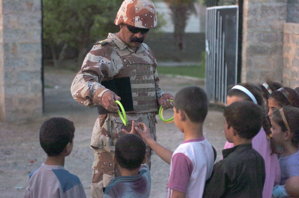 Iraqi Troops Bring Children Toys