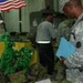 BALAD, Iraq (Nov. 11, 2006) - Master Sgt. Christopher Howard, the 13th Sustainment Command (Expeditionary) food service sergeant major, studies one of the displays at DFAC 4 as part of the Veterans Day DFAC competition Nov. 11. Howard was one of the two j