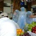 BALAD, Iraq (Nov. 11, 2006) - Workers at DFAC 3 place their eagle ice sculpture in the center of the fruit arrangement for the Veterans Day competition. DFAC 3 won first place in the small dining facility category.