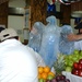 Workers at DFAC 3 place their eagle ice sculpture in the center of the fruit arrangement for the Veterans Day competition. DFAC 3 won first place in the small dining facility category.