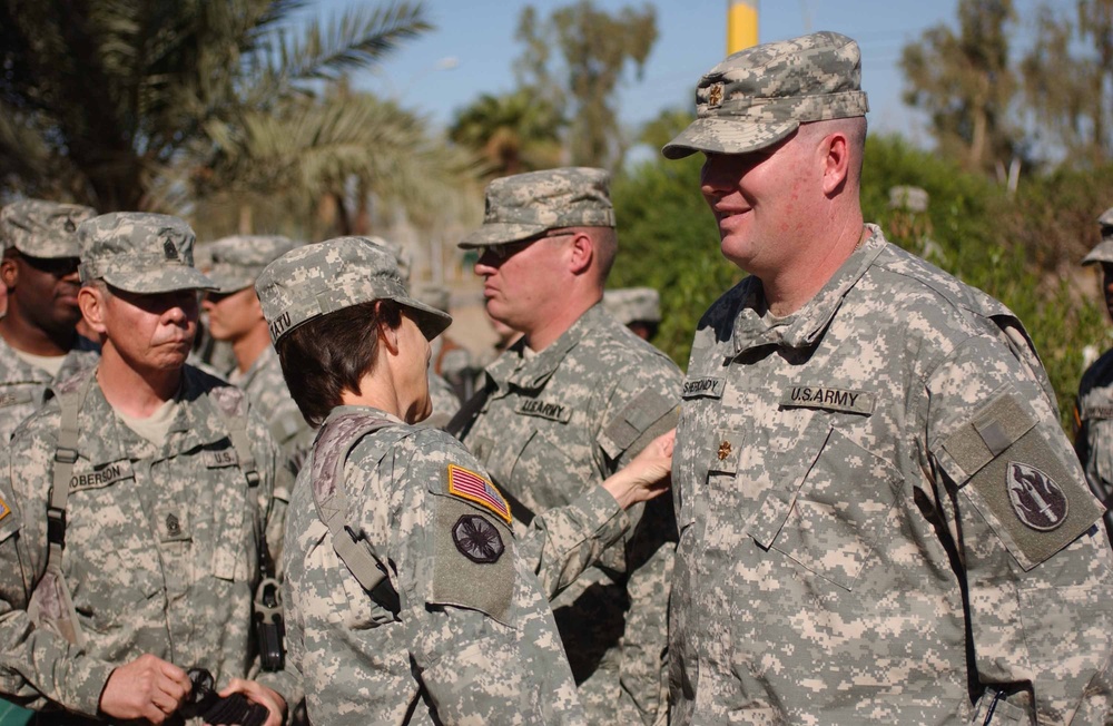 Col. Megan P. Tatu, commander of the 164th CSG, personally attached  the 13th SC (E) combat patch on each Soldier during a Veterans Day patch ceremony on Nov. 11.