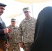 Iraqi Police take female detainee into custody from coalition forces