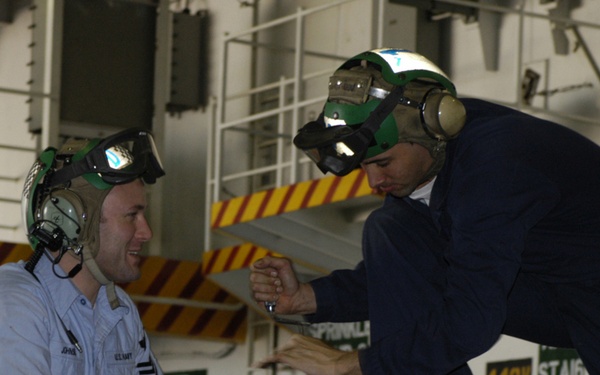 Mechanics Work on F-18 Super Hornet