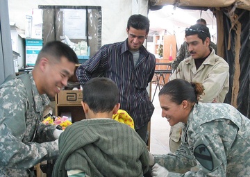 Flight Surgeon in Iraq Treats Injured Local Child