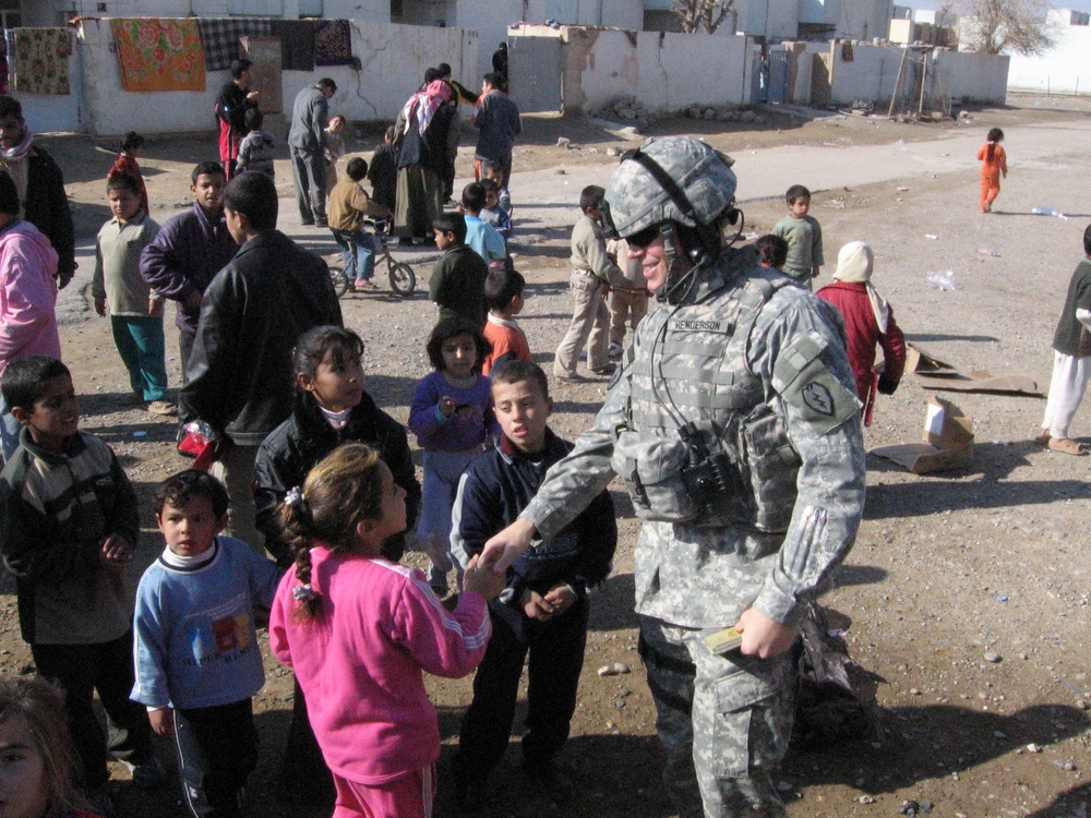 Soldiers and Iraqi Police Work Together to Help Village