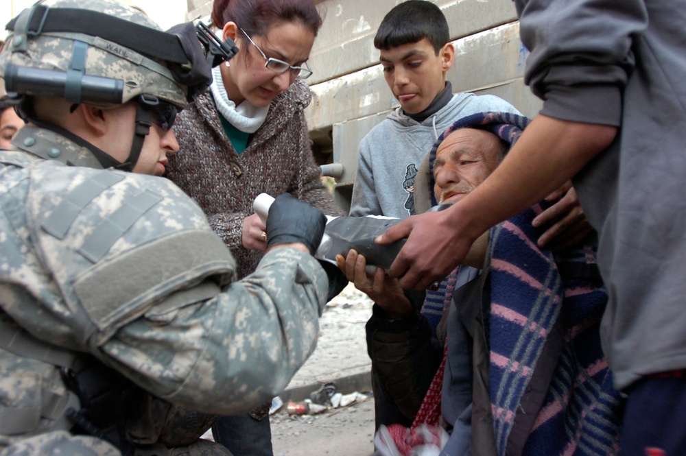 Black Jack Brigade Troops Deliver Food, Water to Residents on Haifa Street