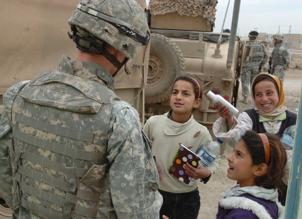 Soldiers Work With Iraqis to Provide Medical Care to Citizens of Sab Al Bor