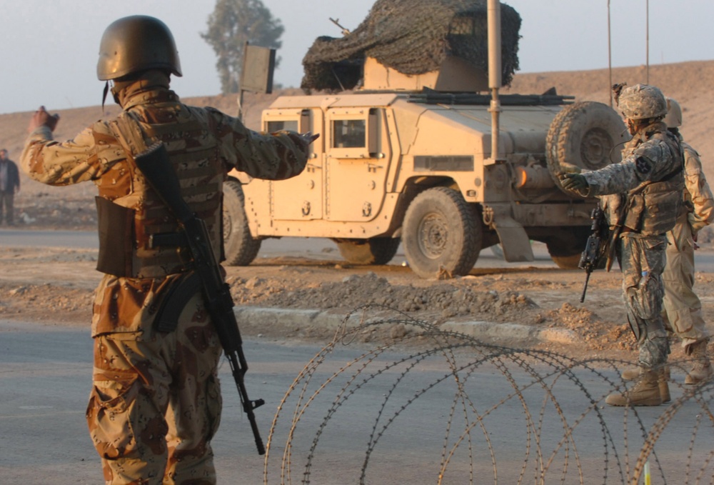 Iraqi Security Forces Work With U.S. Troops at Traffic Control Point