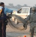 Iraqi Security Forces Work With U.S. Troops at Traffic Control Point