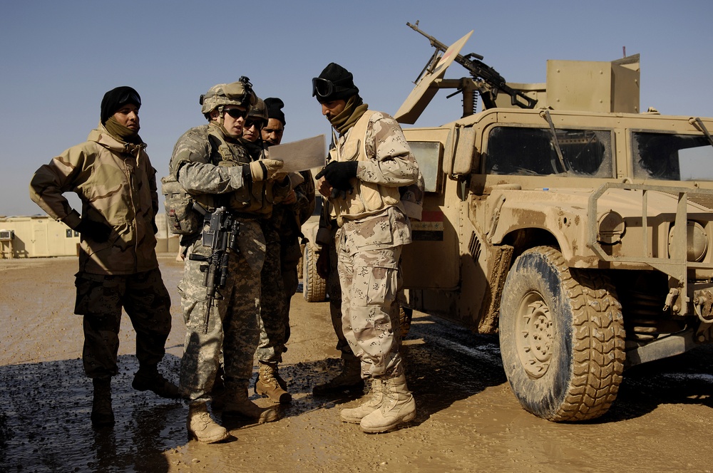 Iraqi army troops lead a patrol