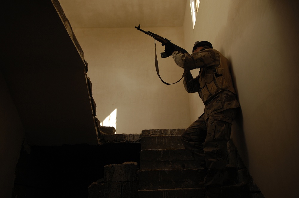 Iraqi army troops lead a patrol