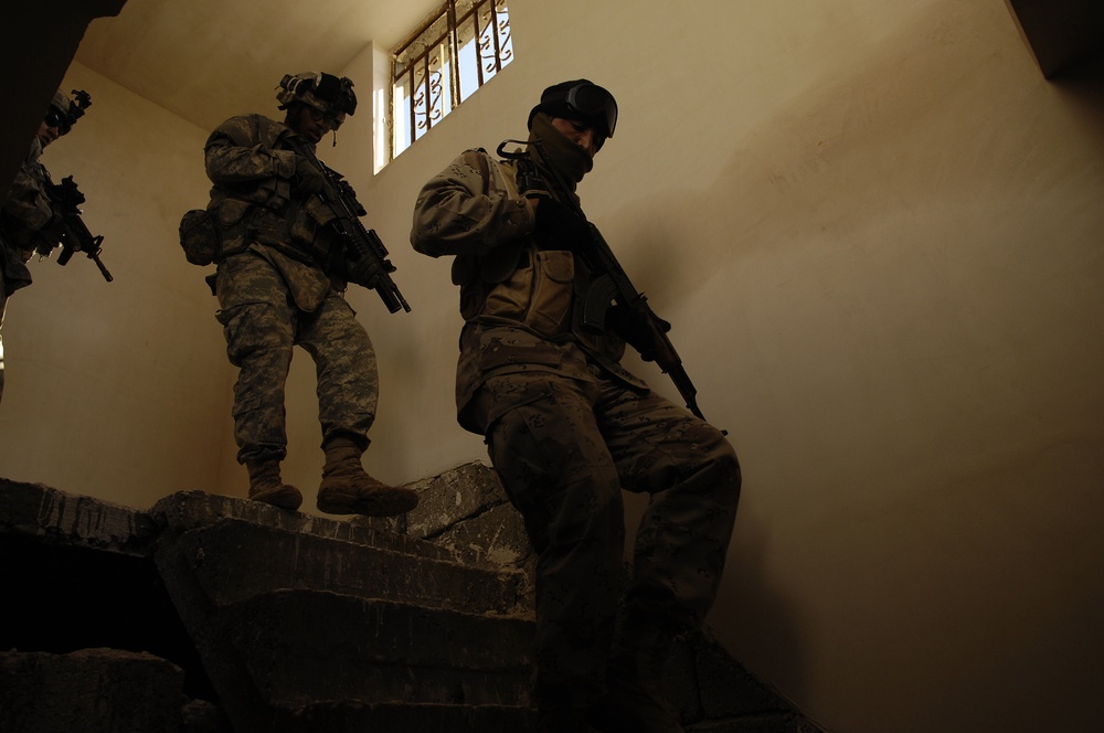 Iraqi army troops lead a patrol