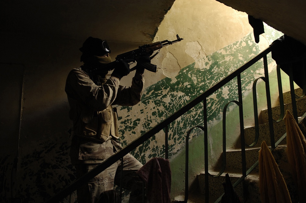 Iraqi army troops lead a patrol