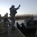 Soldiers build an assault, float bridge outside Camp Taji