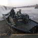 Soldiers build an assault, float bridge outside Camp Taji