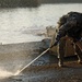 Soldiers build an assault, float bridge outside Camp Taji